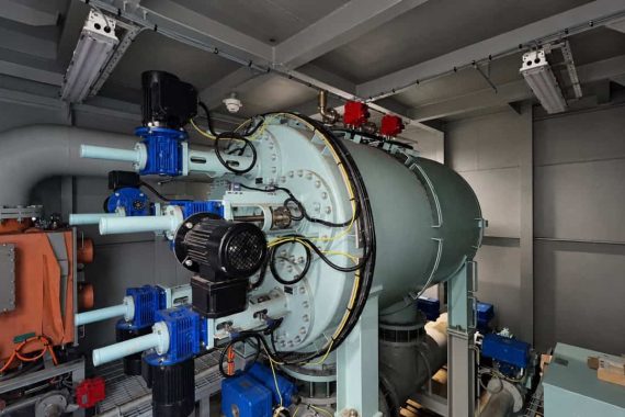Close-up of marine water treatment system with pipes and valves.